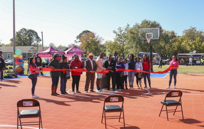Port Arthur Mayor Thurman Bartie cuts the ribbon on the new basketball court at Bryan Park in Port Arthur, which was donated by Sparkling Ice. (Photo: Leo Weeks Photography)