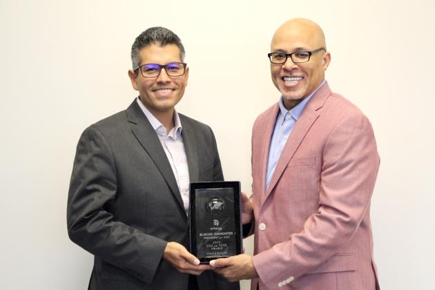 Entergy Texas President and CEO Eliecer 'Eli' Viamontes receives CEO of the Year award from Dennis Kennedy, founder and CEO of the National Diversity Council.
